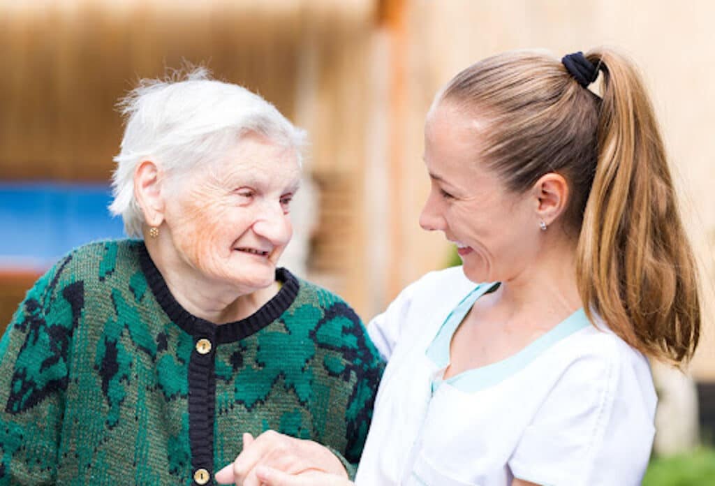 Craft & Communicate | Smiling senior woman with compassionate caregiver