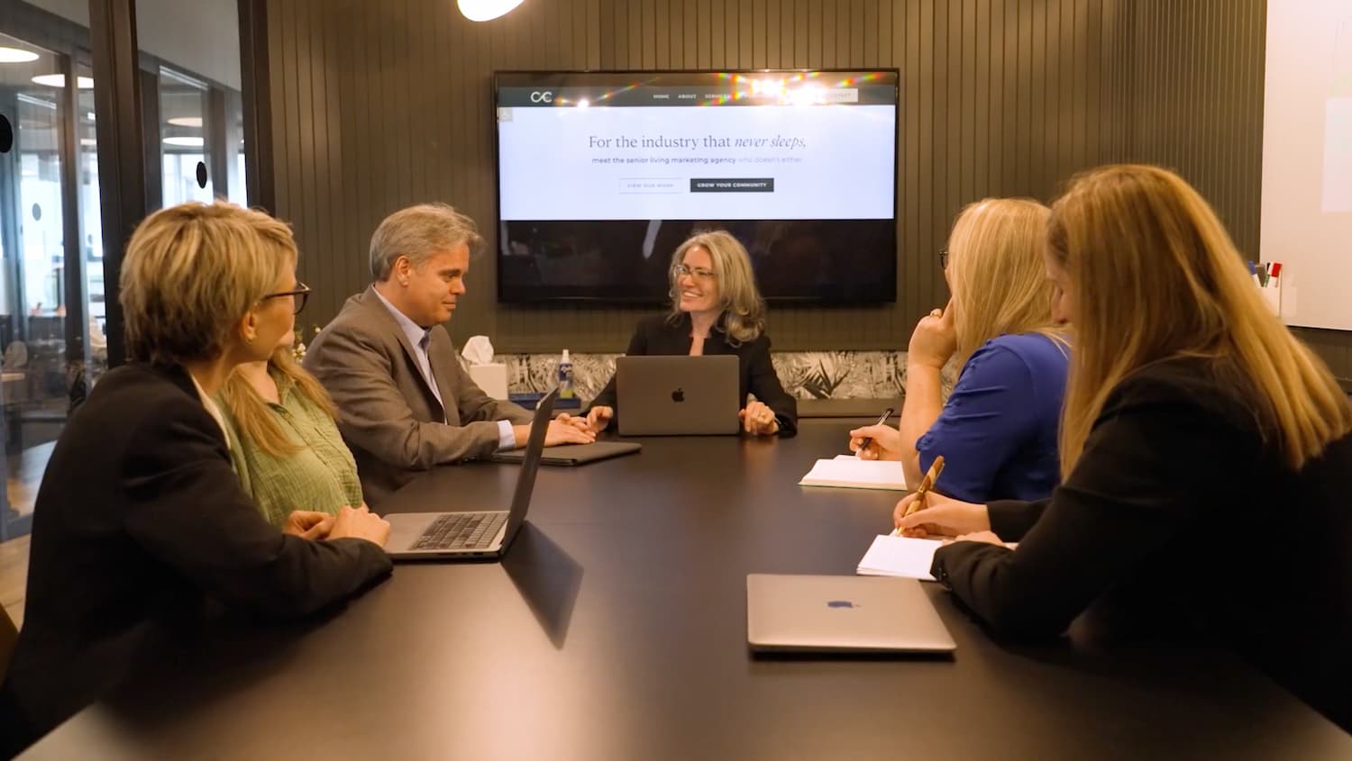 Craft & Communicate | Team members sitting at table discussing senior living communities marketing solutions