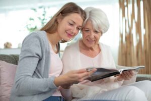 Craft and Communicate | Grandmother and daughter looking through a magazine