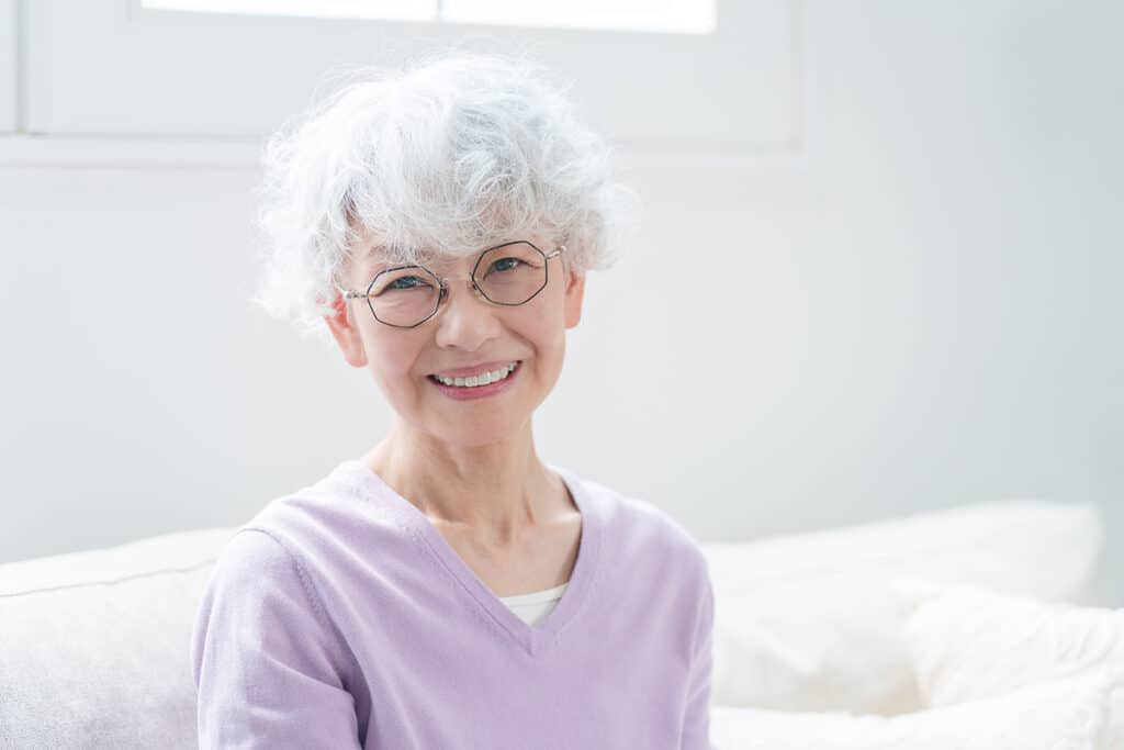 Craft & Communicate | Happy Senior Woman Sitting In Living Room