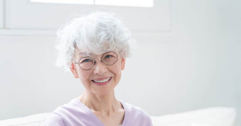 Craft & Communicate | Happy Senior Woman Sitting In Living Room